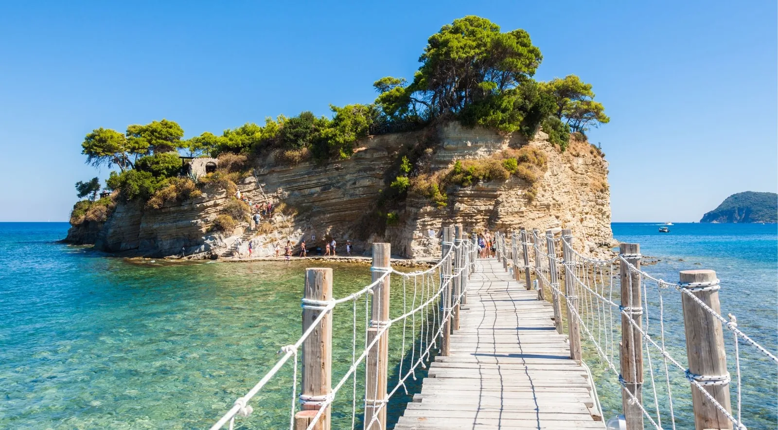 The wooden rope-railed footbridge running out to the wooded islet of Cameo.